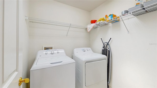 7337 Hunters Greene Cir, Lakeland, FL 33810 - laundry area with washer and clothes dryer