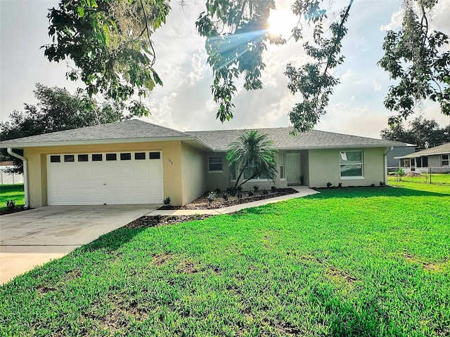709 N Polk Ave, Fort Meade, FL 33841 - single story home featuring an attached garage, stucco siding, concrete driveway, and a front yard