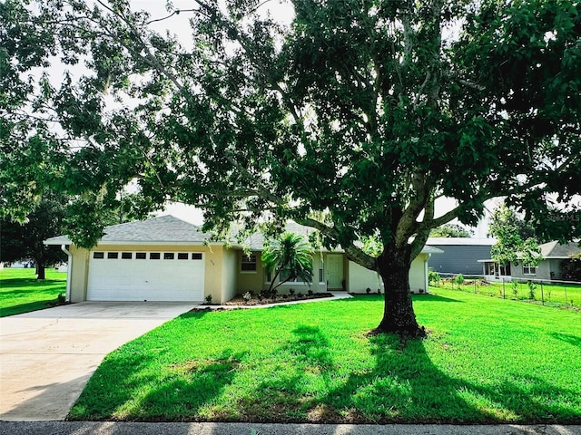 709 N Polk Ave, Fort Meade, FL 33841 - view of front of property with a garage, concrete driveway, and stucco siding