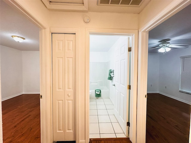 709 N Polk Ave, Fort Meade, FL 33841 - corridor with wood finished floors and baseboards