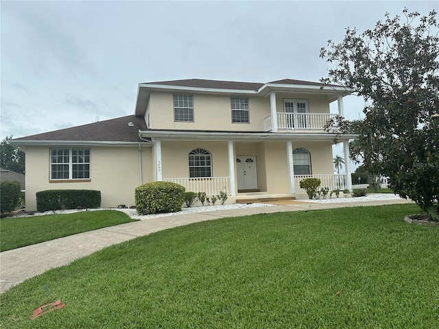 5480 Summerland Hills Dr, Lakeland, FL 33812 - view of front of home featuring stucco siding, a porch, and a front yard