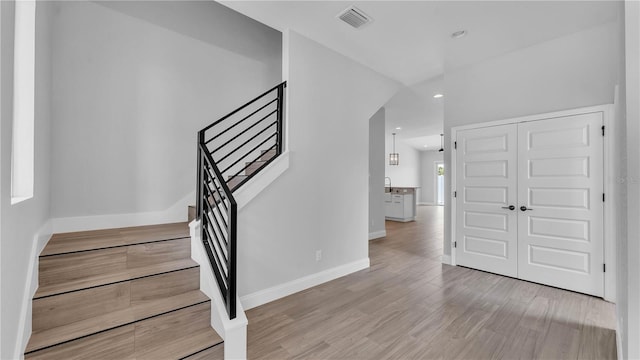 1170 Windjammer Dr, Lakeland, FL 33803 - foyer entrance with stairs, light wood-style floors, and recessed lighting
