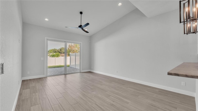 1170 Windjammer Dr, Lakeland, FL 33803 - unfurnished room featuring ceiling fan, light wood-type flooring, a chandelier, lofted ceiling, and recessed lighting