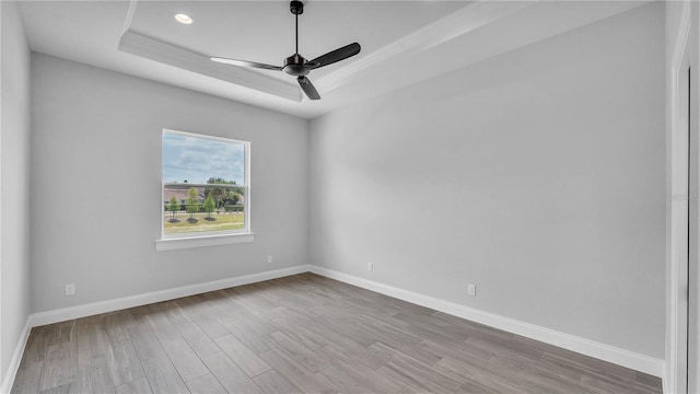 1170 Windjammer Dr, Lakeland, FL 33803 - unfurnished room with a tray ceiling, wood finished floors, a ceiling fan, and recessed lighting