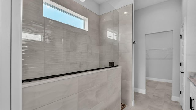 1170 Windjammer Dr, Lakeland, FL 33803 - bathroom with a walk in shower, a spacious closet, and vanity