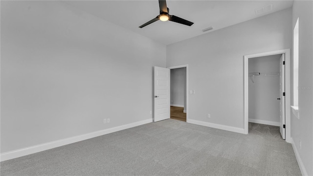 1170 Windjammer Dr, Lakeland, FL 33803 - unfurnished bedroom with carpet, a closet, ceiling fan, and a spacious closet