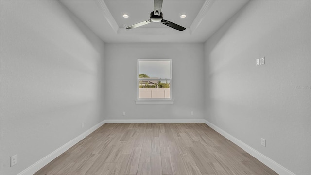 1170 Windjammer Dr, Lakeland, FL 33803 - empty room with a tray ceiling, light wood-type flooring, ceiling fan, and recessed lighting