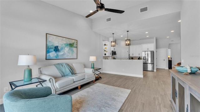 1172 Windjammer Dr, Lakeland, FL 33803 - living room featuring ceiling fan, light wood-type flooring, and recessed lighting