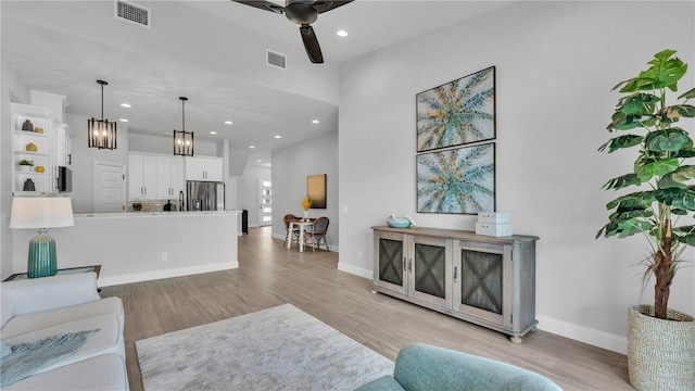 1172 Windjammer Dr, Lakeland, FL 33803 - living area featuring ceiling fan, a chandelier, recessed lighting, and light wood-type flooring