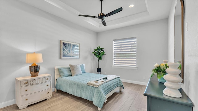 1172 Windjammer Dr, Lakeland, FL 33803 - bedroom featuring a raised ceiling, light wood-style flooring, recessed lighting, and ceiling fan