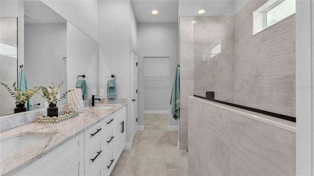1172 Windjammer Dr, Lakeland, FL 33803 - bathroom with double vanity, walk in shower, a spacious closet, and recessed lighting