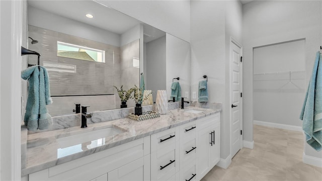 1172 Windjammer Dr, Lakeland, FL 33803 - full bath with double vanity, a walk in shower, and a spacious closet