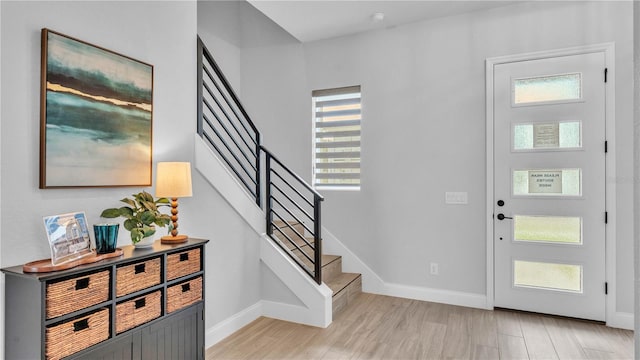 1172 Windjammer Dr, Lakeland, FL 33803 - entrance foyer with stairs, plenty of natural light, and light wood-style floors
