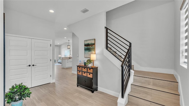 1172 Windjammer Dr, Lakeland, FL 33803 - foyer with stairway, recessed lighting, and light wood-style floors