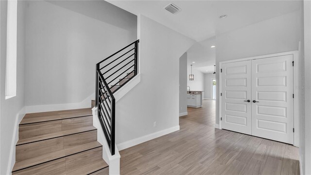 1172 Windjammer Dr, Lakeland, FL 33803 - foyer entrance with stairs, light wood-style floors, and recessed lighting