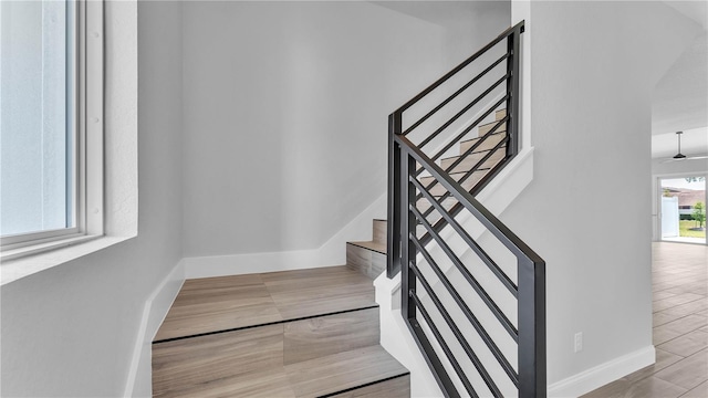 1172 Windjammer Dr, Lakeland, FL 33803 - stairway with baseboards and wood finished floors