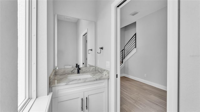 1172 Windjammer Dr, Lakeland, FL 33803 - bathroom with vanity and wood finished floors