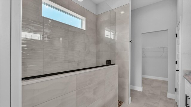 1172 Windjammer Dr, Lakeland, FL 33803 - bathroom with a walk in shower, a spacious closet, and vanity
