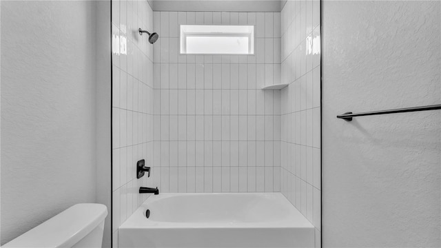 1172 Windjammer Dr, Lakeland, FL 33803 - bathroom with a textured wall and bathtub / shower combination