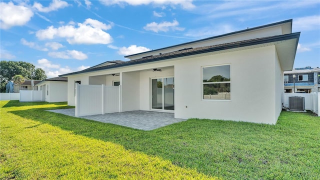 1172 Windjammer Dr, Lakeland, FL 33803 - back of house with a ceiling fan, a patio, and stucco siding