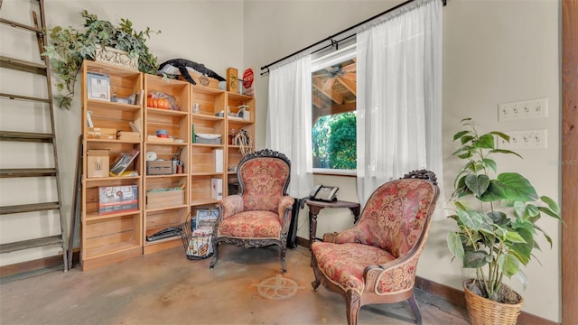 841 E Valencia St, Lakeland, FL 33805 - sitting room featuring concrete flooring and stairs