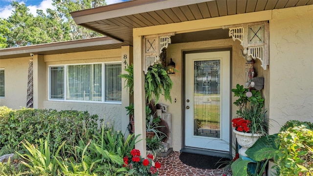 841 E Valencia St, Lakeland, FL 33805 - doorway to property with stucco siding