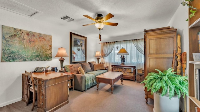 841 E Valencia St, Lakeland, FL 33805 - carpeted living room with ceiling fan, a textured ceiling, and baseboards