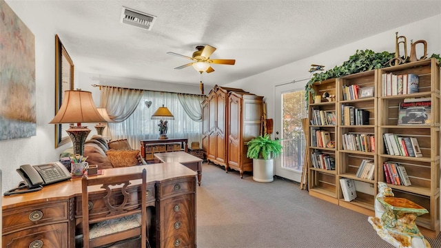 841 E Valencia St, Lakeland, FL 33805 - home office with ceiling fan, light carpet, and a textured ceiling