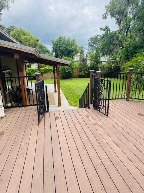 841 E Valencia St, Lakeland, FL 33805 - wooden terrace featuring a yard