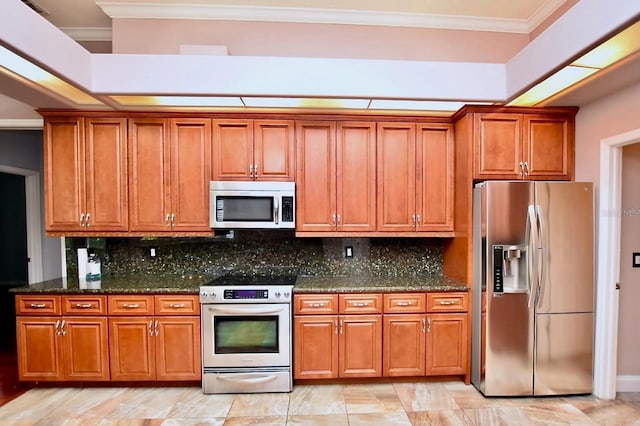 943 Hamilton Place Ln, Lakeland, FL 33813 - kitchen featuring stainless steel appliances, brown cabinets, dark stone counters, and ornamental molding