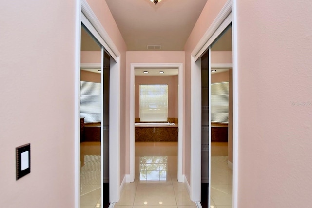 943 Hamilton Place Ln, Lakeland, FL 33813 - hallway with tile patterned flooring and baseboards