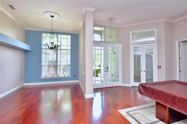 943 Hamilton Place Ln, Lakeland, FL 33813 - foyer entrance with french doors, crown molding, wood finished floors, pool table, and a chandelier