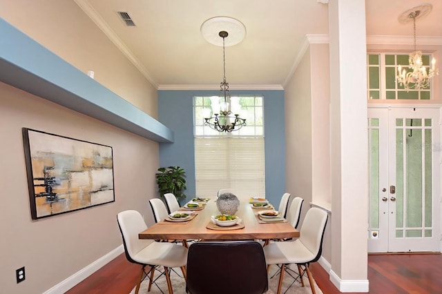 943 Hamilton Place Ln, Lakeland, FL 33813 - dining area with a chandelier, wood finished floors, crown molding, and french doors