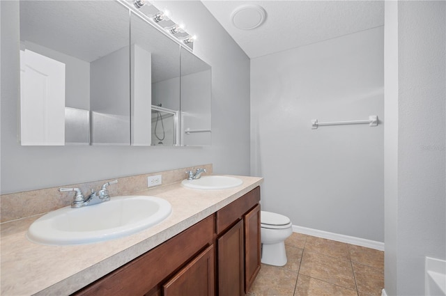 6819 Glenbrook Dr, Lakeland, FL 33811 - full bathroom featuring double vanity, toilet, baseboards, a shower, and tile patterned floors