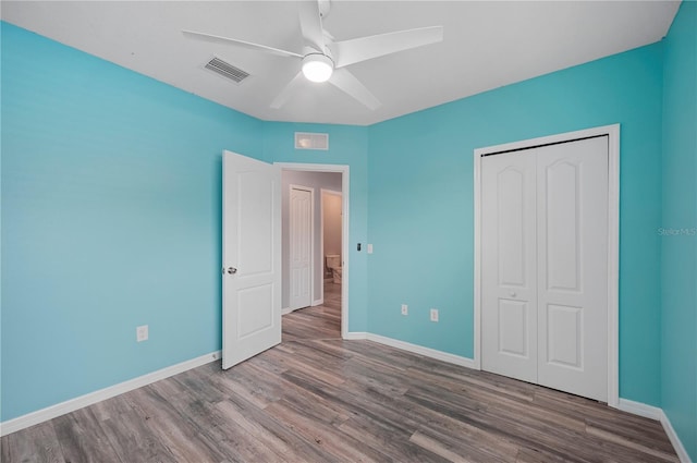 6819 Glenbrook Dr, Lakeland, FL 33811 - unfurnished bedroom featuring wood finished floors, baseboards, and a closet