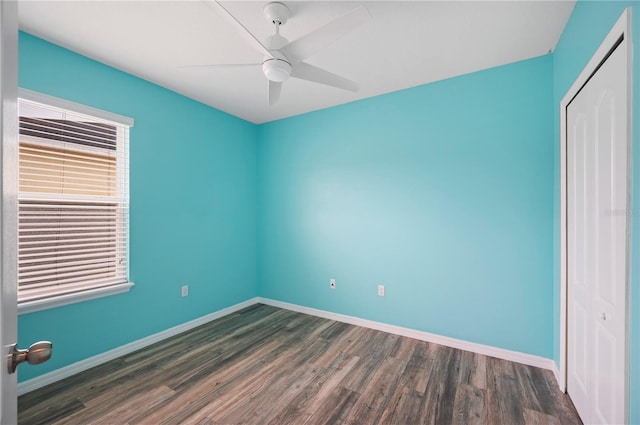 6819 Glenbrook Dr, Lakeland, FL 33811 - unfurnished bedroom featuring dark wood-style flooring, a closet, baseboards, and a ceiling fan