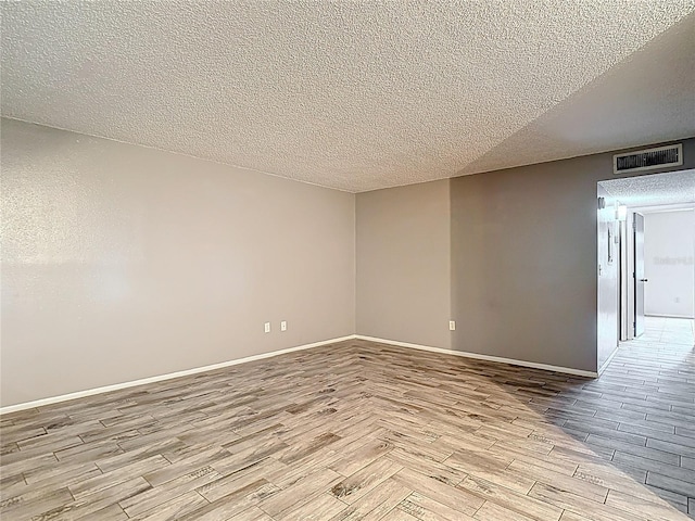 11704 Raintree Village Blvd Unit B, Temple Terrace, FL 33617 - unfurnished room with wood finished floors and a textured ceiling
