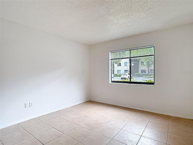 11704 Raintree Village Blvd Unit B, Temple Terrace, FL 33617 - unfurnished room featuring a textured ceiling and light tile patterned floors