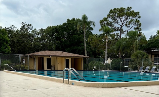 11704 Raintree Village Blvd Unit B, Temple Terrace, FL 33617 - community pool featuring view of scattered trees and a patio area