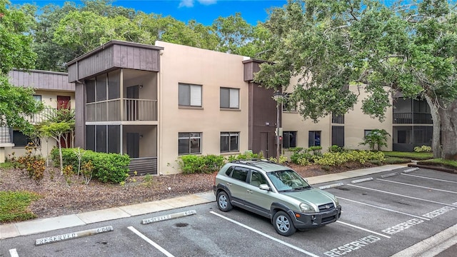 11704 Raintree Village Blvd Unit B, Temple Terrace, FL 33617 - view of property featuring uncovered parking
