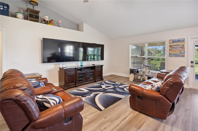 1531 Blue Sky Blvd, Haines City, FL 33844 - living room featuring vaulted ceiling and wood finished floors