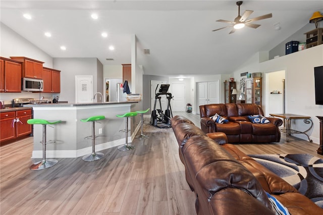 1531 Blue Sky Blvd, Haines City, FL 33844 - living room with light wood finished floors, ceiling fan, recessed lighting, and high vaulted ceiling