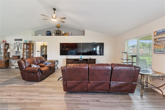 1531 Blue Sky Blvd, Haines City, FL 33844 - living room with lofted ceiling, a ceiling fan, and wood finished floors
