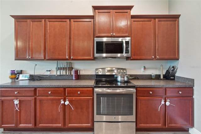 1531 Blue Sky Blvd, Haines City, FL 33844 - kitchen with appliances with stainless steel finishes and dark countertops