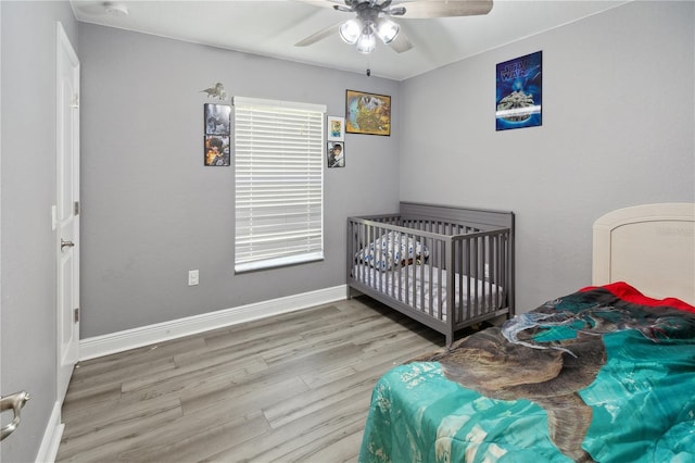 1531 Blue Sky Blvd, Haines City, FL 33844 - bedroom featuring wood finished floors and ceiling fan
