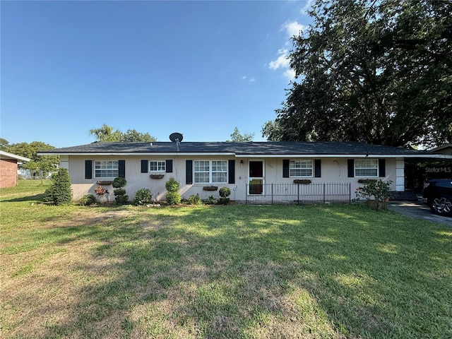 2424 Bates Ave SW, Winter Haven, FL 33880 - ranch-style home with a front yard, stucco siding, and a carport