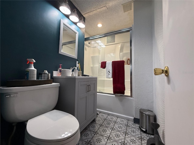 2424 Bates Ave SW, Winter Haven, FL 33880 - bathroom with toilet, vanity, enclosed tub / shower combo, and baseboards
