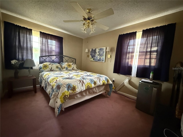 2424 Bates Ave SW, Winter Haven, FL 33880 - bedroom with carpet floors, a ceiling fan, a textured ceiling, and baseboards