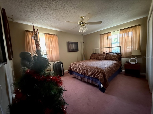 2424 Bates Ave SW, Winter Haven, FL 33880 - bedroom featuring a textured ceiling, carpet floors, ceiling fan, and baseboards