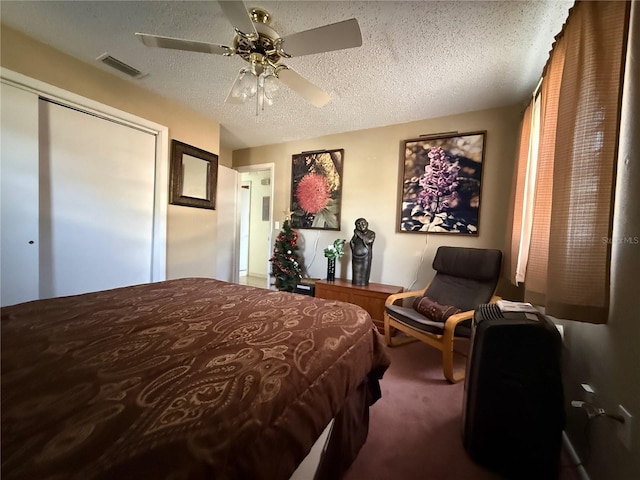2424 Bates Ave SW, Winter Haven, FL 33880 - carpeted bedroom with a ceiling fan, a textured ceiling, and a closet